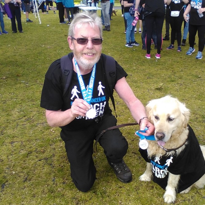 Man kneeling with a dog Man kneeling with a dog